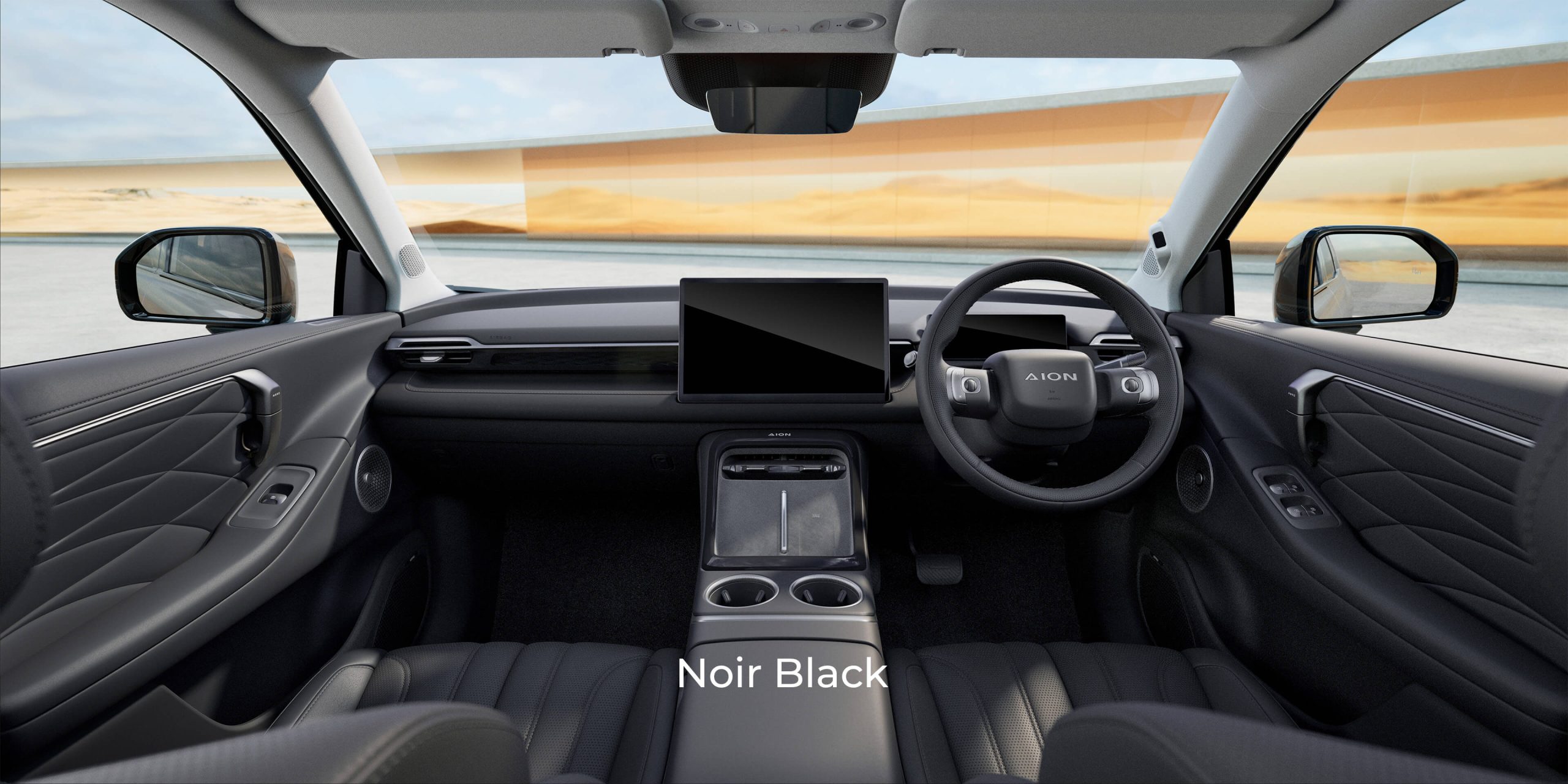Right-hand-drive AION V cabin in Noir Black, showing the dashboard, central touchscreen and front seats