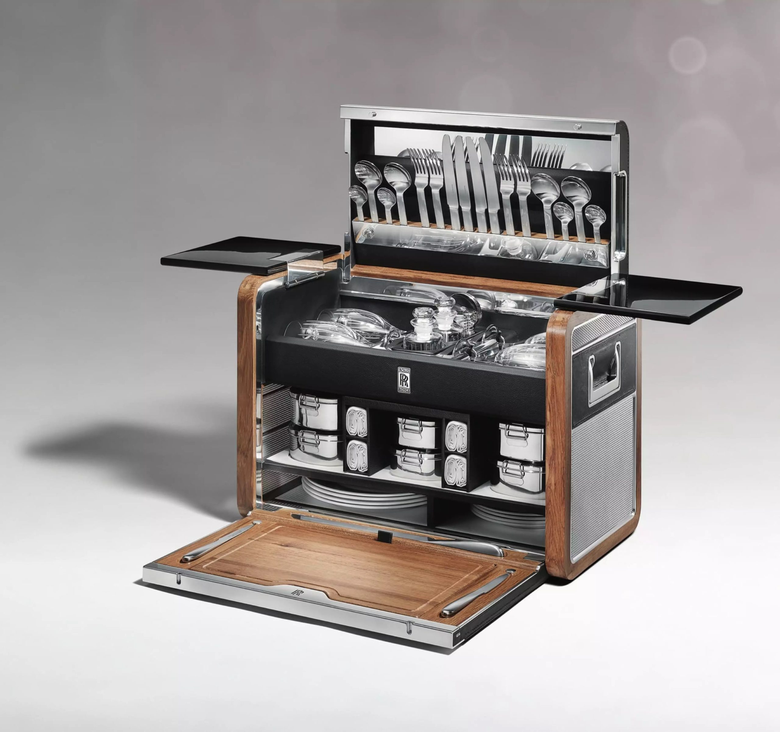Open Rolls-Royce luxury picnic hamper with china, glasses and polished cutlery